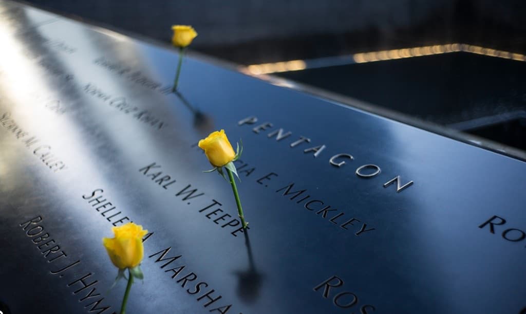 Yellow roses placed in names at the National September 11 Memorial