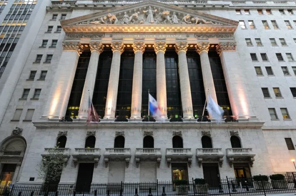 New York Stock Exchange facade illuminated at night