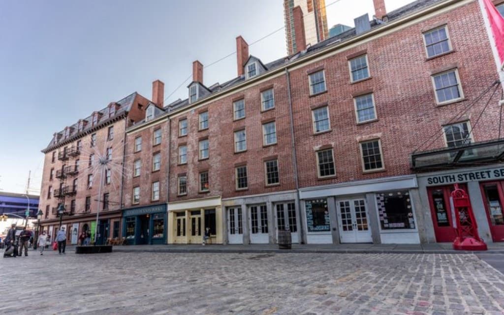 Cobblestone Stone Street with historic brick buildings in FiDi